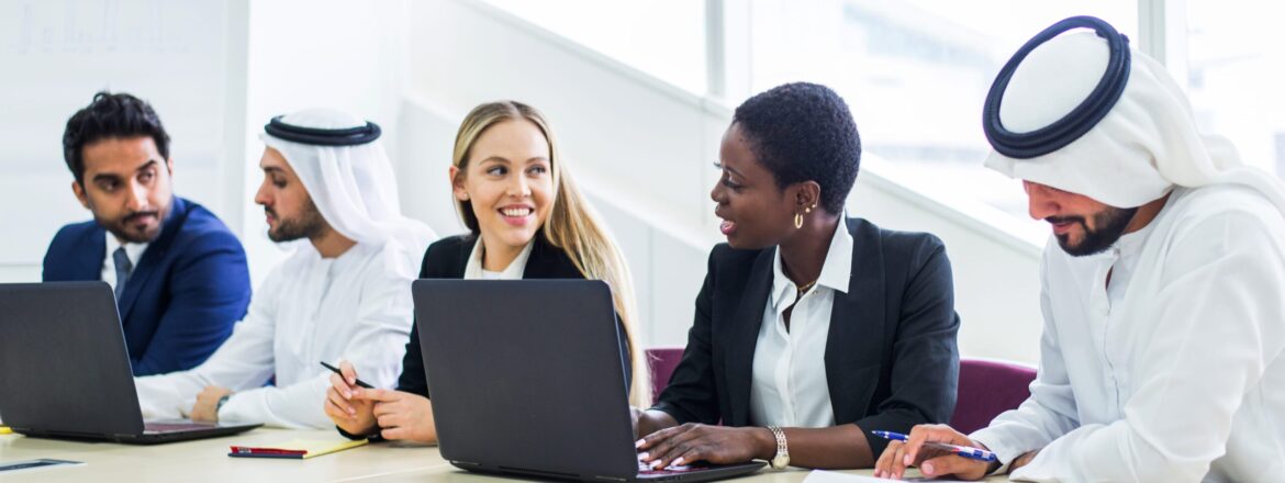 Multiracial group of business people having a meeting in a office - Teamwork in the office, business meeting in the UAE