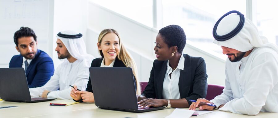 Multiracial group of business people having a meeting in a office - Teamwork in the office, business meeting in the UAE